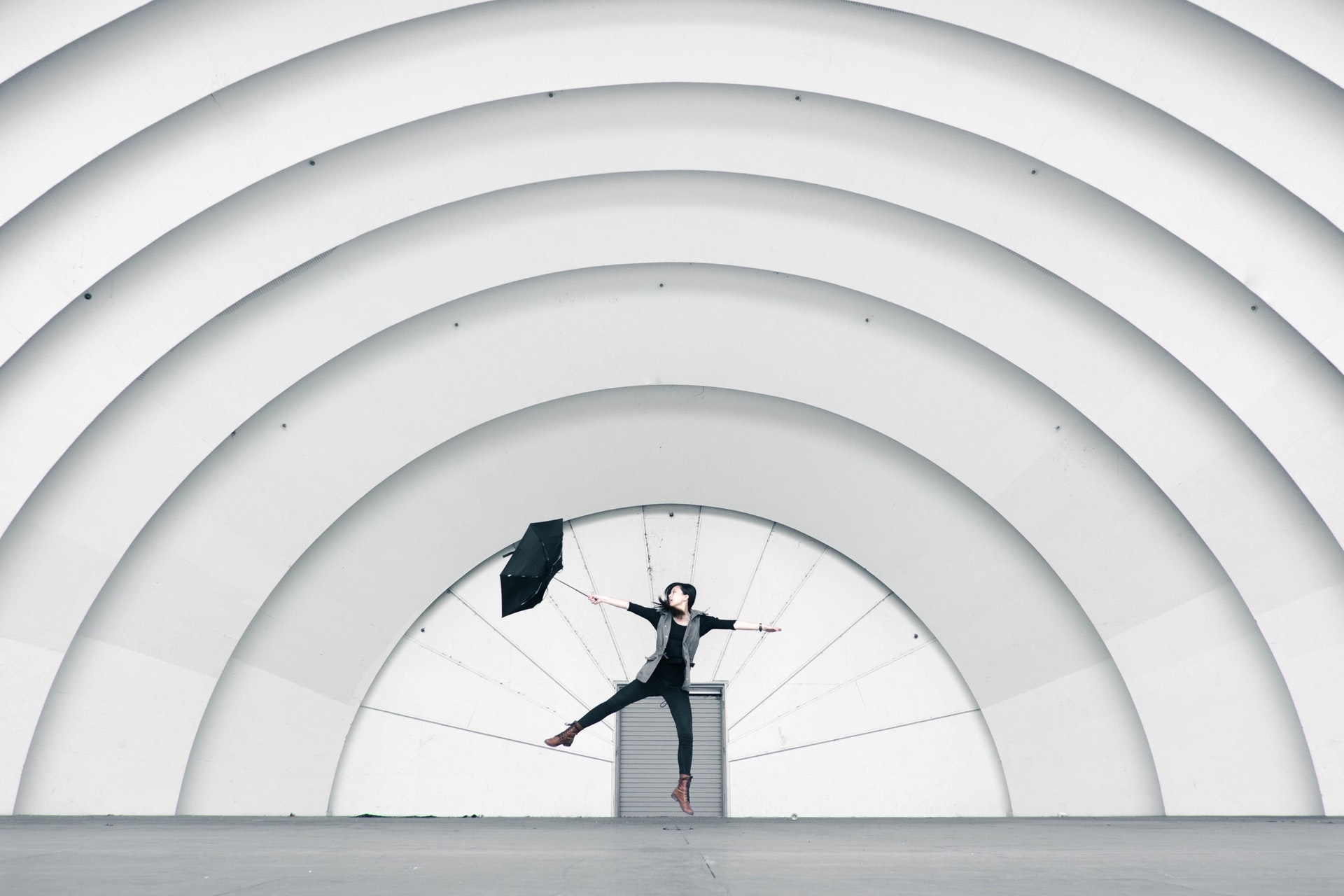 https://www.pexels.com/photo/girl-jumping-while-holding-umbrella-270859/